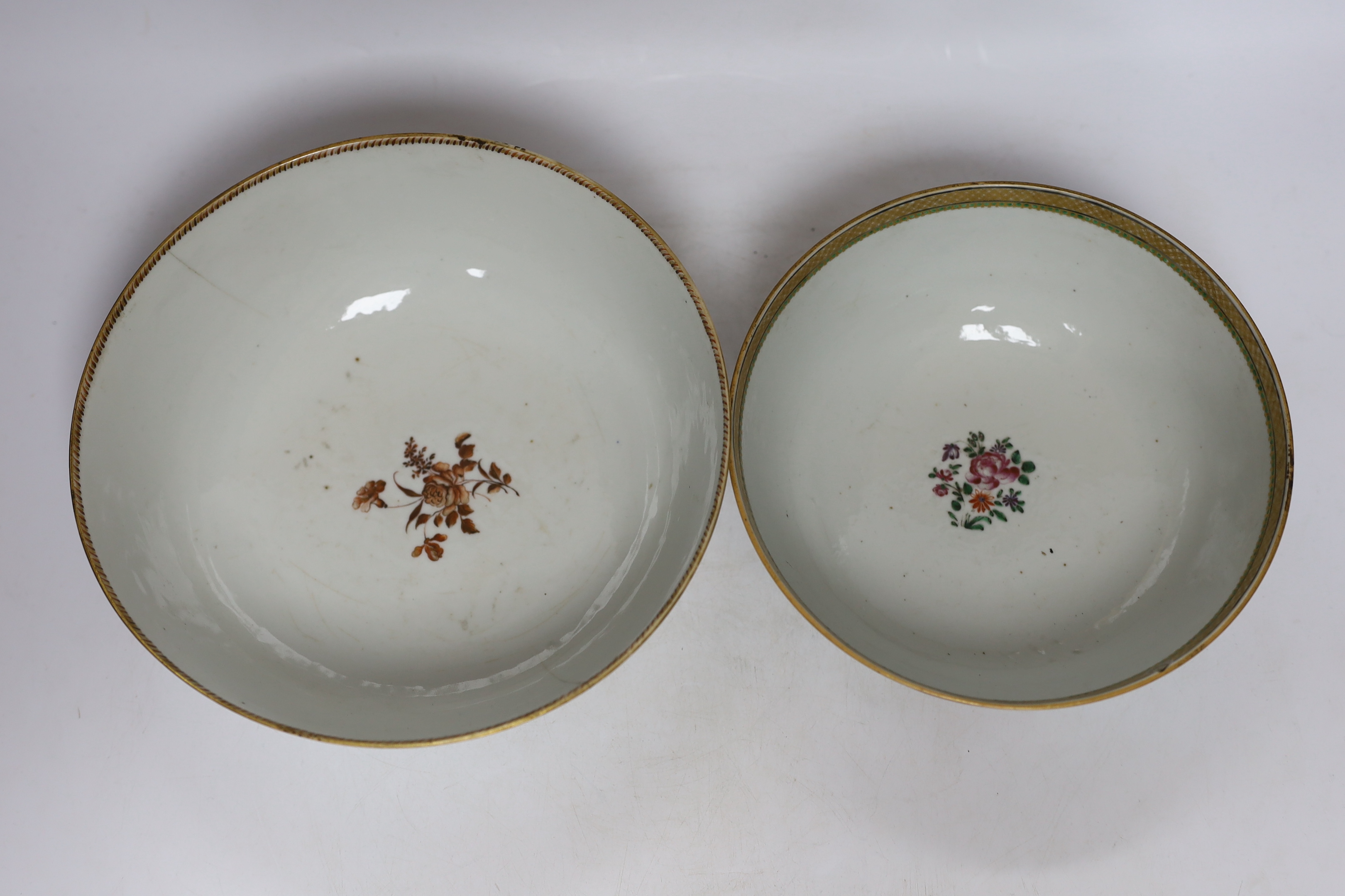 A Chinese famille rose bowl and dish and two similar bowls, all Qianlong period, largest diameter 23cm